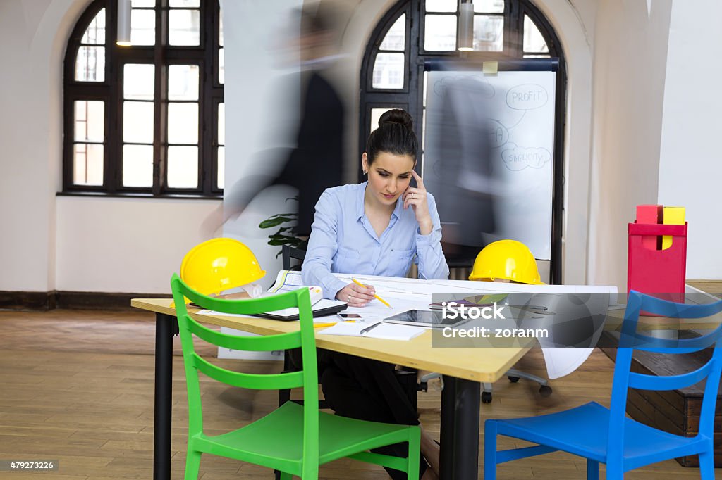 Female designer at work Creative beautiful woman working, hblurred motion in background 2015 Stock Photo