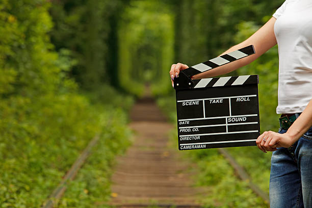 istock Girl holding clapper board in her hands 479274676