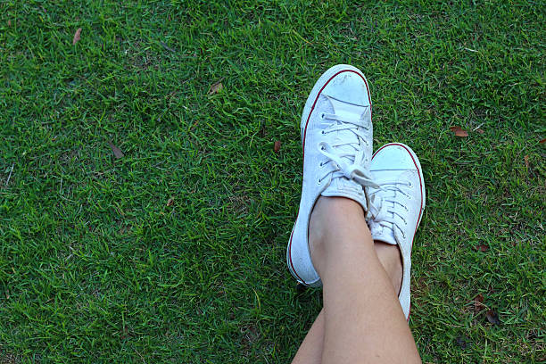 istock White shoes on a green grass background. 479274930