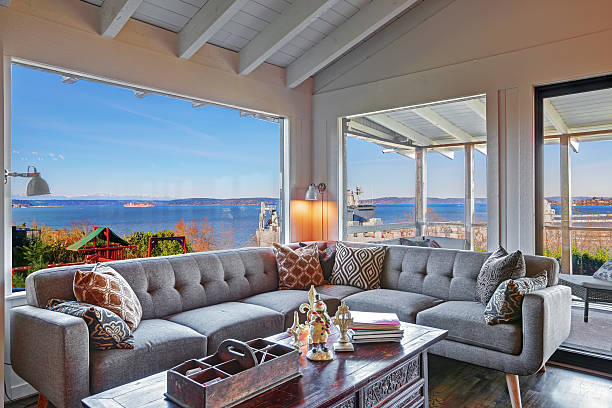 istock Living room with water view and large grey modern sofa. 479276968
