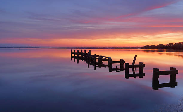 istock Serene water and stunning sunrise at Gorokan Jetty Australia 479281422