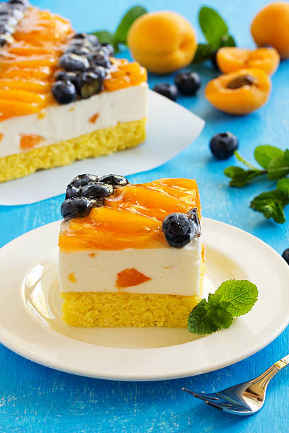 istock Sponge cake with yogurt mousse, apricots and blueberries. 479282486