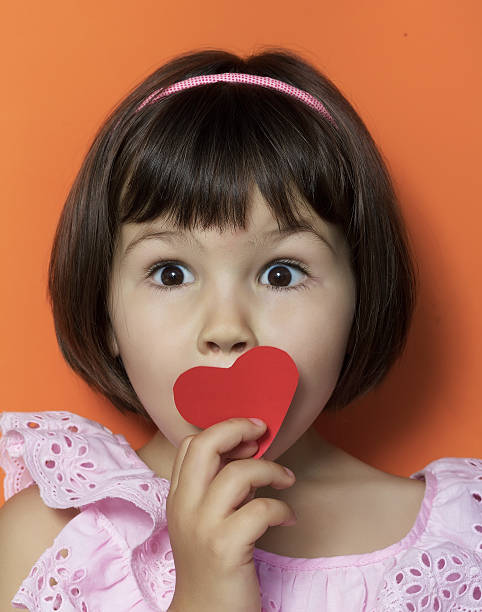 istock Little girl and red hearts. 479282803