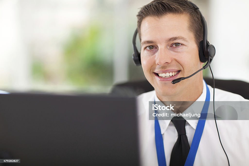 male customer support operator with headset smiling male customer support operator with headset Adult Stock Photo