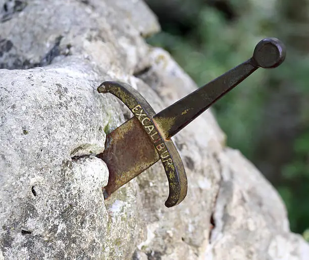 excalibur the sword in the stone of king Arthur in the forest