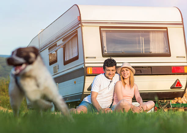 istock Young couple with a camper van 479286550