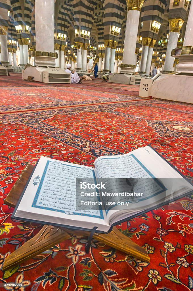Quran Medina, Saudi Arabia - March 8, 2015: A Quran inside of Nabawi mosque. Nabawi Mosque is the second holiest mosque in Islam Hajj Stock Photo
