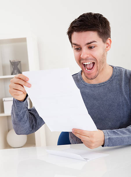 istock Exultant young man cheering good news 479286666