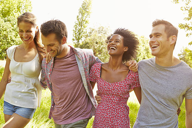 istock Four friends walking together in the countryside 479287980
