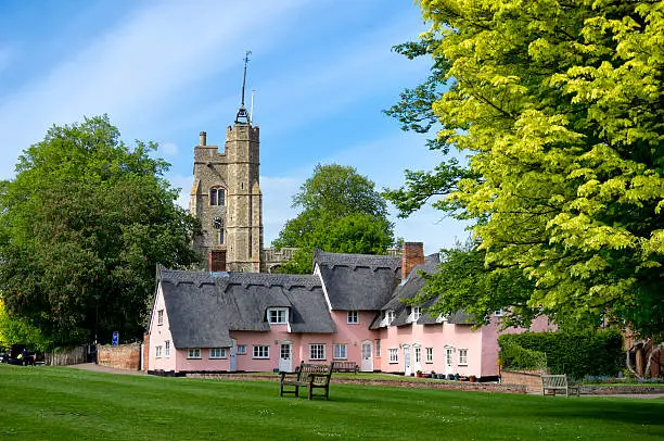 The church and village green in the pretty Suffolk village of Cavendish in eastern England. The village is a popular spot with tourists.