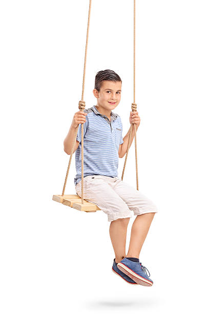 istock Joyful little kid sitting on a swing 479288344