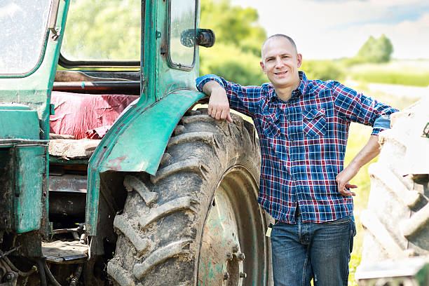 istock farmer driving tractor in  countryside 479288350