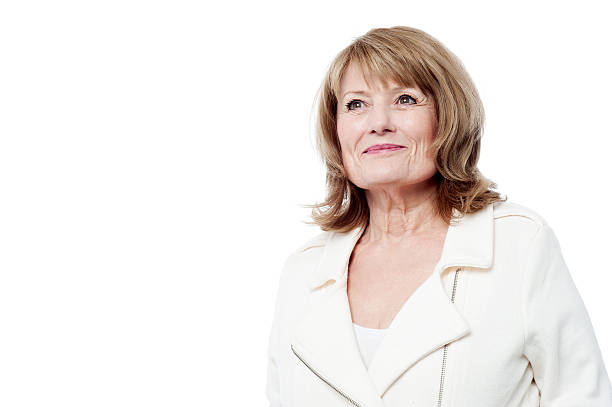 istock Beautiful aged woman looking upwards 479289722