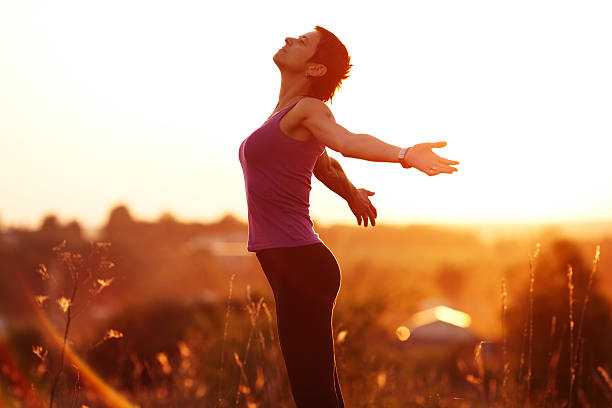 istock Happy young woman with arms outstretched 479290282