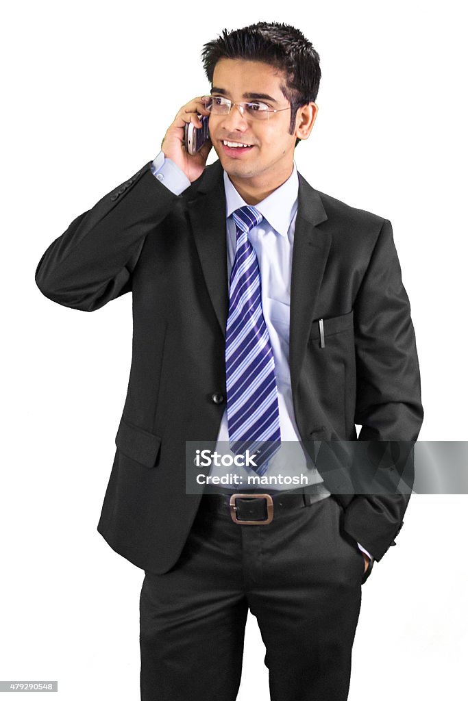 Young professioinal talking on his cell phone Isolated on white background 2015 Stock Photo