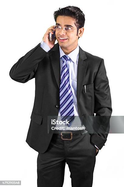 Young Professioinal Talking On His Cell Phone Stock Photo - Download Image Now - 2015, Adult, Adults Only