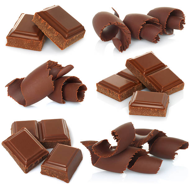 Chocolate shavings with blocks set on white background stock photo