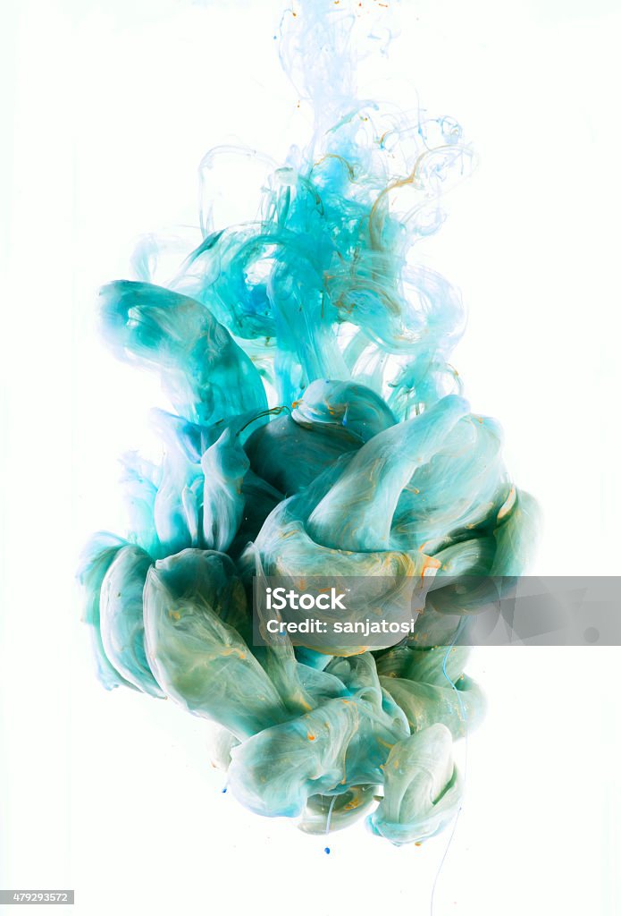 color drop mixes underwater Colors drop underwater. Blue and green Liquid colors isolated on white background. Color mixing. 2015 Stock Photo