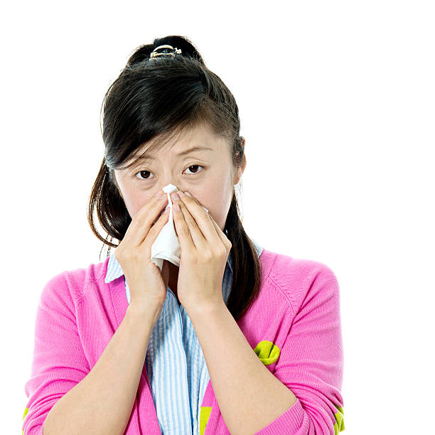 istock Young asian woman blowing her nose 479296200