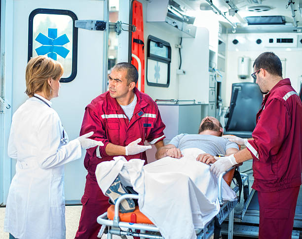 istock Medical emergency team helping injured man 479296556