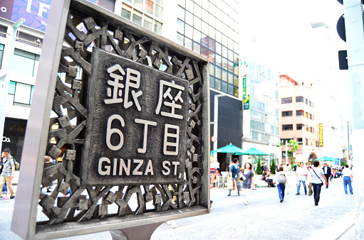 Tokyo, Japan - May 26, 2012: Shoppers and tourists line the streets of Ginza in Tokyo.