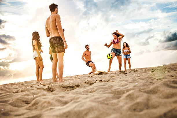 istock Friends playing soccer on the beach 479296856