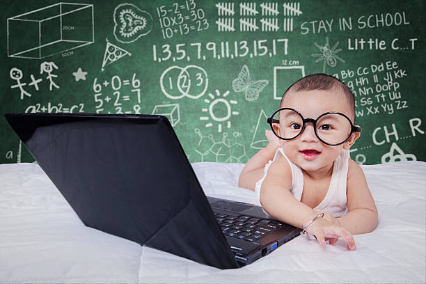 istock Smart baby with laptop and doodles 479296884