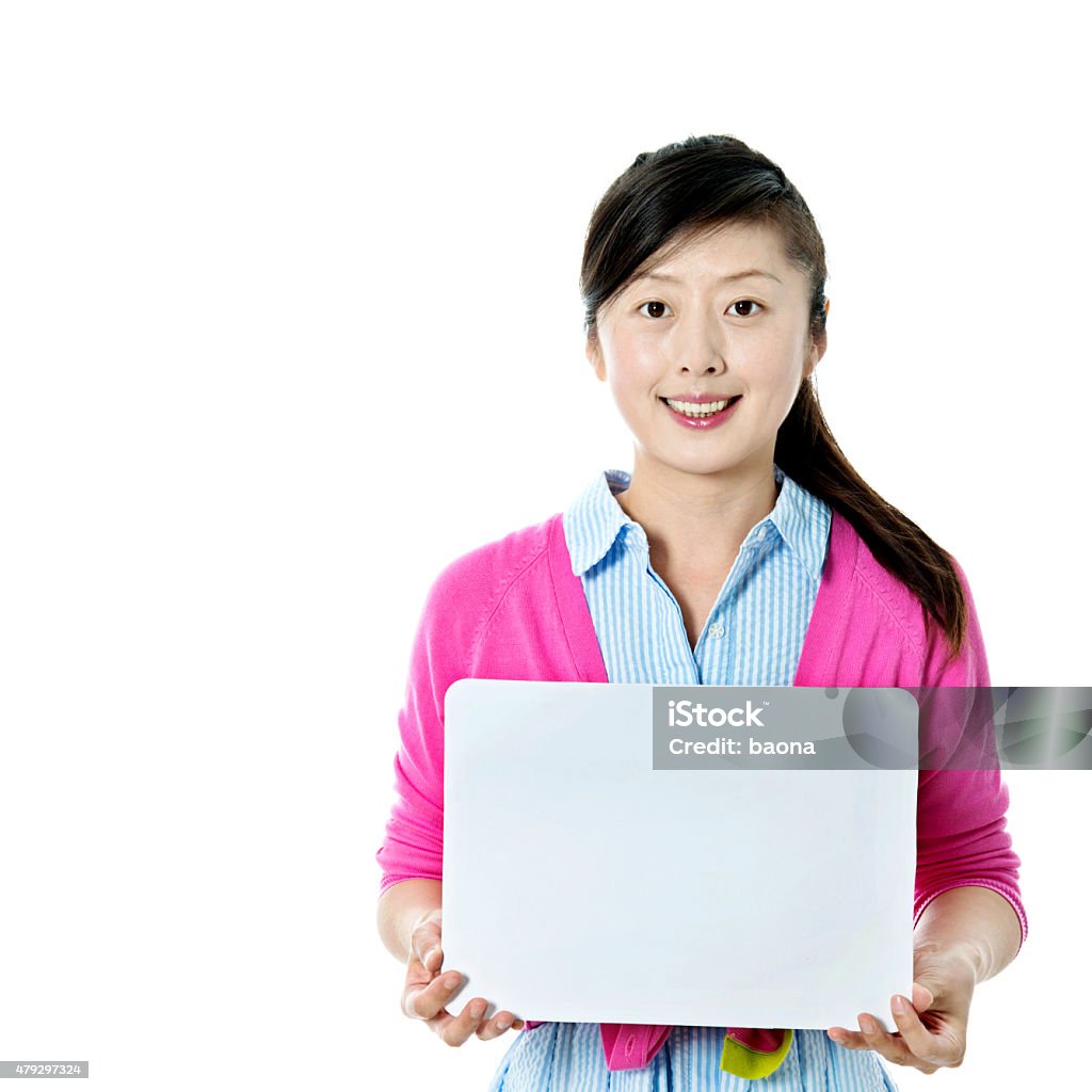 Asian woman holding a blank board Asian woman holding a blank board isolated on white background. 2015 Stock Photo