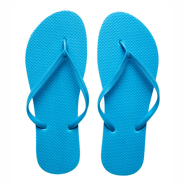 Blue flip-flops isolated Pair of blue flip-flops isolated on a white background. slipper stock pictures, royalty-free photos & images