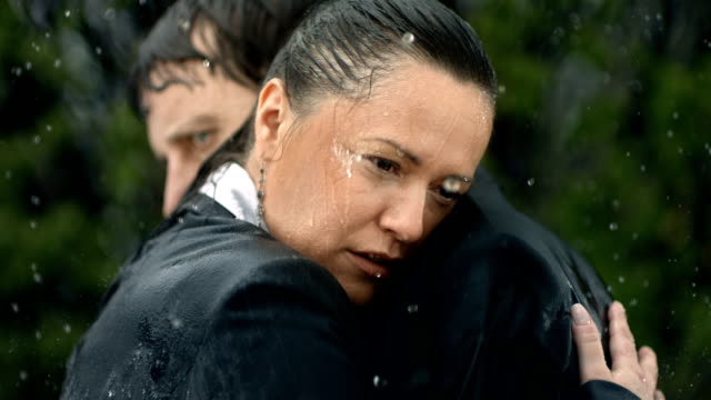 HD Super Slow-Mo: Worried Couple In The Rain