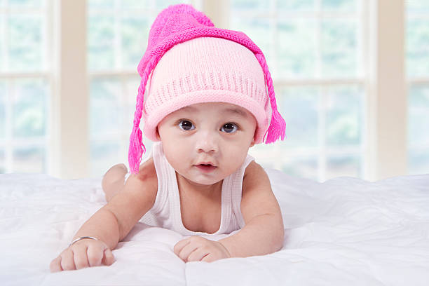 istock Cute baby boy with hat on bed 479298368