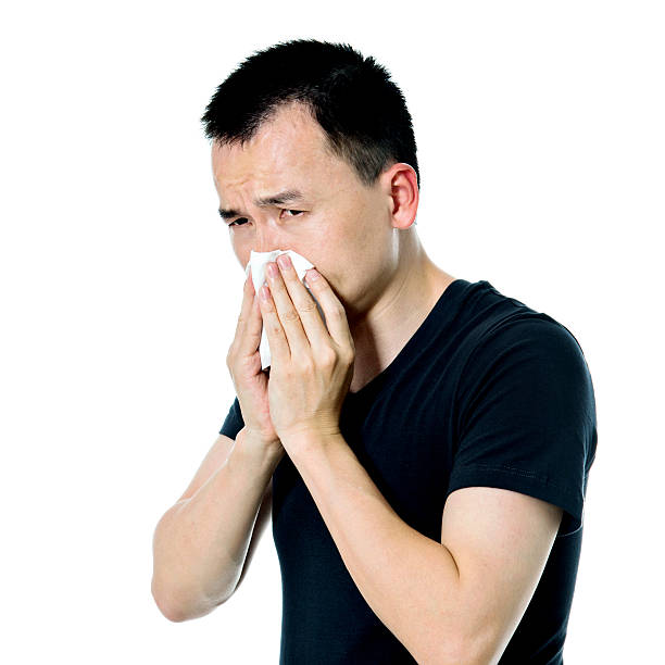 istock Young asian man blowing his nose 479299010