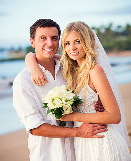 istock bride and groom at sunset on tropical beach 479299324