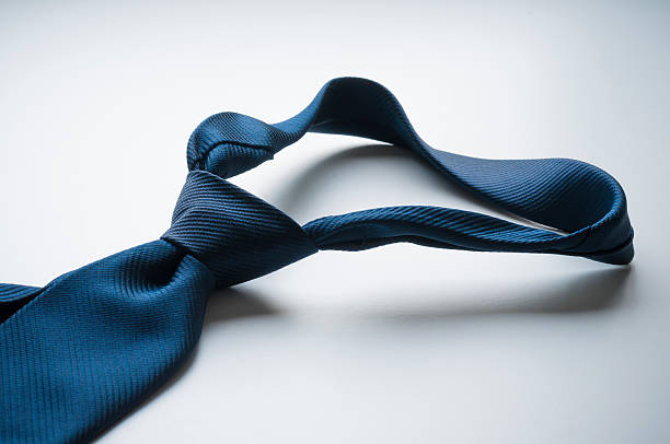 Blue tie and bow tie on white shirt, men clothing idea, sitting view, men fashion concept, blue color accessories