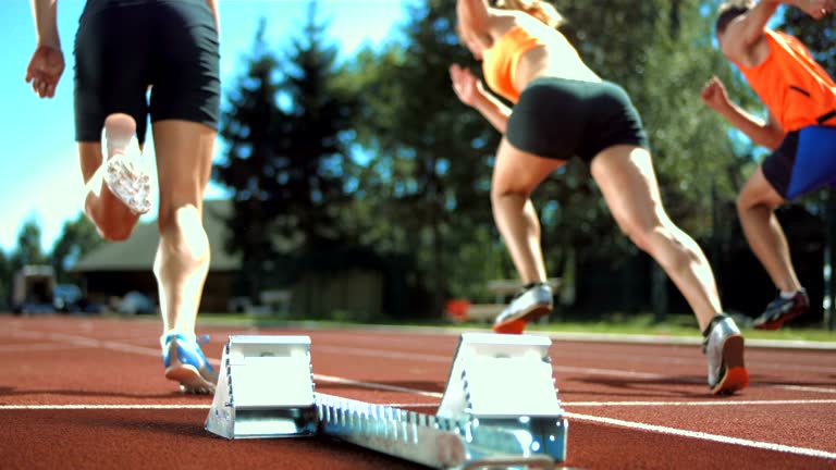 HD Super Slow-Mo: Group Of Runners Starting Off