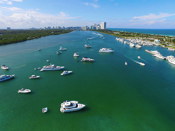 Aerial Miami intracoastal yachts on the weekend Aerial image of boats in the waters of the Intracoastal waterway in Miami Beach FL sandbar stock pictures, royalty-free photos & images