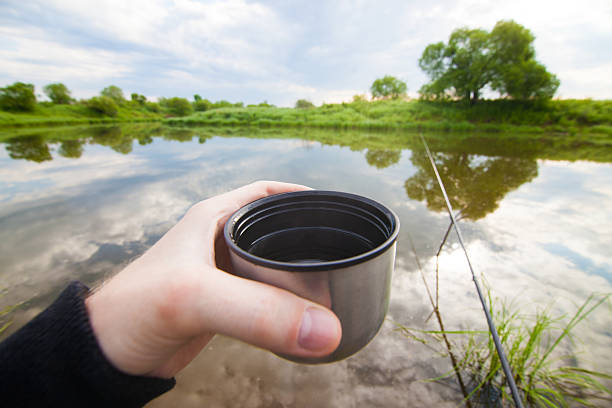 istock Fisherman is going to drink tea from thermos 479304146