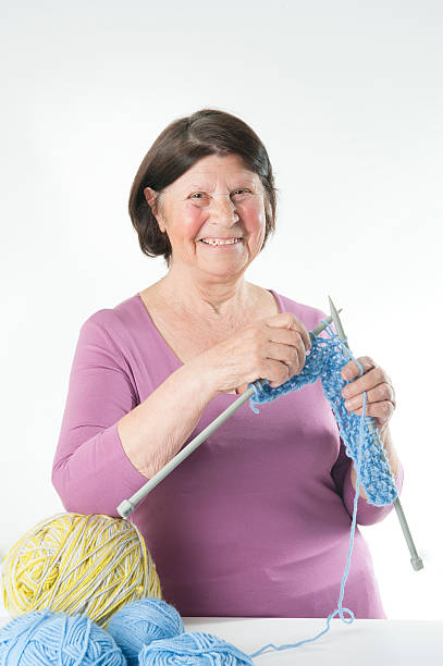 istock Elderly woman knits. 479305118