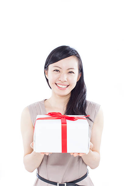 istock young woman holding a gift 479305156