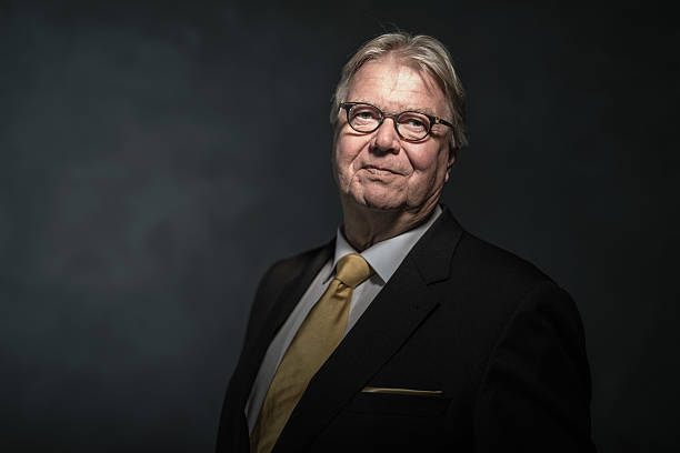 istock Senior businessman on dark background 479305222