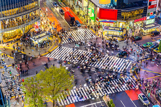Shibuya Crossing in Tokyo Tokyo, Japan view of Shibuya Crossing, one of the busiest crosswalks in the world. shinjuku ward photos stock pictures, royalty-free photos & images