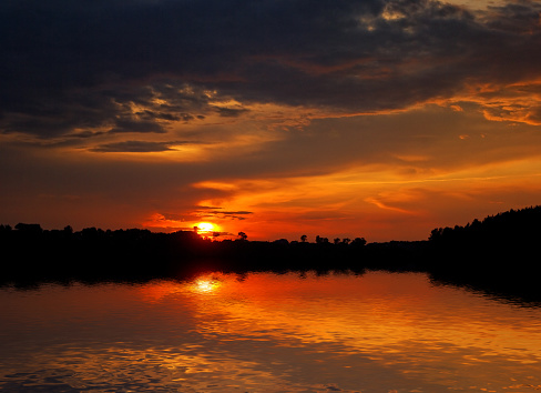 bright orange sunset over water