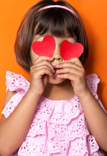 istock Little girl and red hearts. 479309109