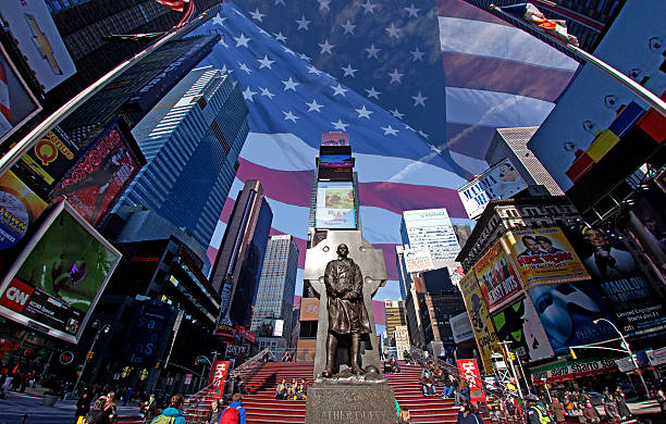 A busy street scene in Times Square in midtown manhattan while tourists and cars crowd the street and sidewalks.