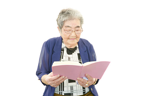 istock Old woman reading her book 479309735