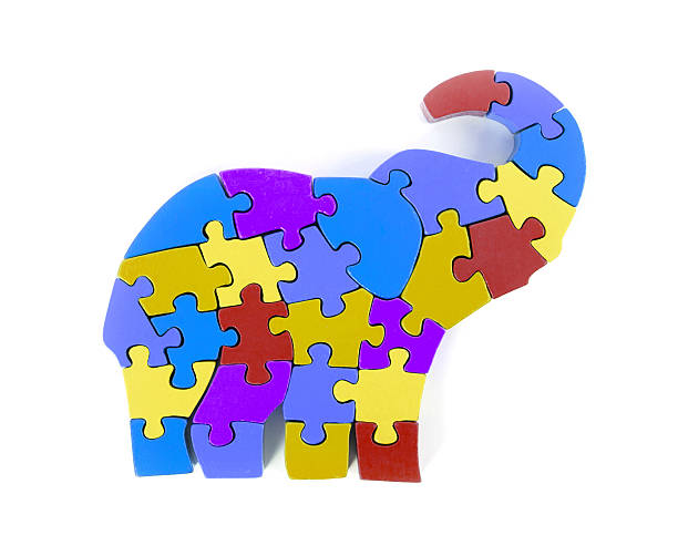istock Colorful puzzle pieces in elephant shape 479311018