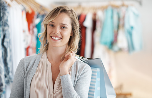 Shot of a young woman in a clothing storehttp://195.154.178.81/DATA/i_collage/pu/shoots/805077.jpg