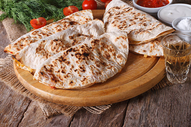 istock Quesadilla with sour cream and tomato sauce horizontal 479312396