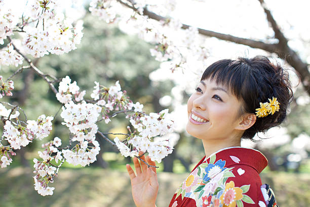 istock Kimono girl and cherry blossoms 479313073