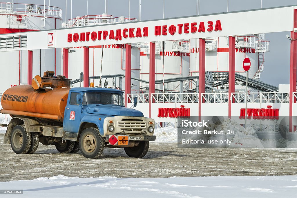 Russian truck stands amid tank farms Volgograd, Russia - February 7, 2014: The old Soviet tanker truck ZIL stands amid LUKOIL tank farms. The background - the Central entrance to the territory of the Volgograd oil terminal Cargo Container Stock Photo